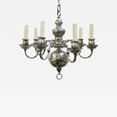 A SEVEN ARM SILVERED SINGLE TIER CHANDELIER