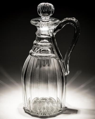 A SLICE CUT REGENCY PERIOD CLARET JUG