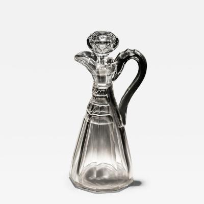 A SLICE CUT WILLIAM IV CLARET JUG OF UNUSUAL FORM