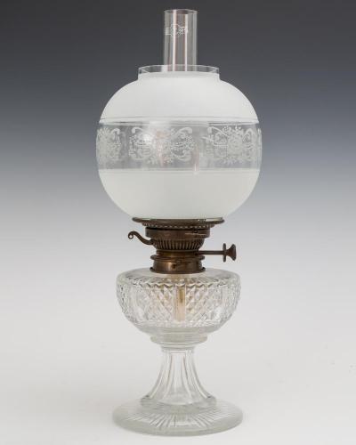 A SMALL CUT GLASS VICTORIAN OIL LAMP