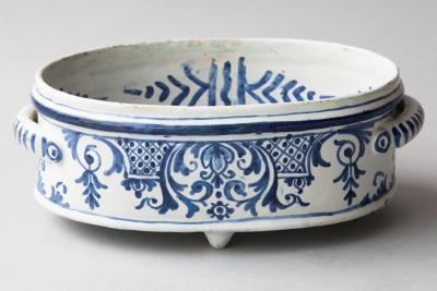 A SMALL FAIENCE TWO HANDLED BASSIN OR JARDINIERE