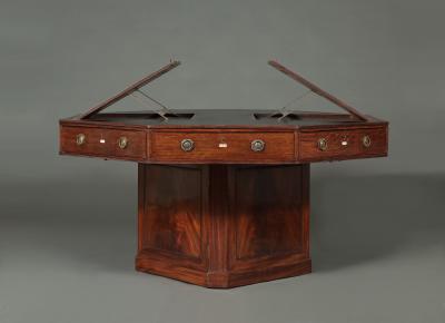 A SPECTACULAR GEORGE III MAHOGANY OCTAGONAL SWIVEL TOP LIBRARY TABLE
