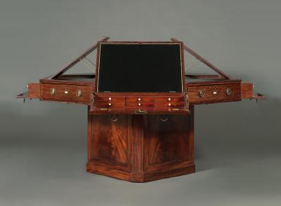 A SPECTACULAR GEORGE III MAHOGANY OCTAGONAL SWIVEL TOP LIBRARY TABLE