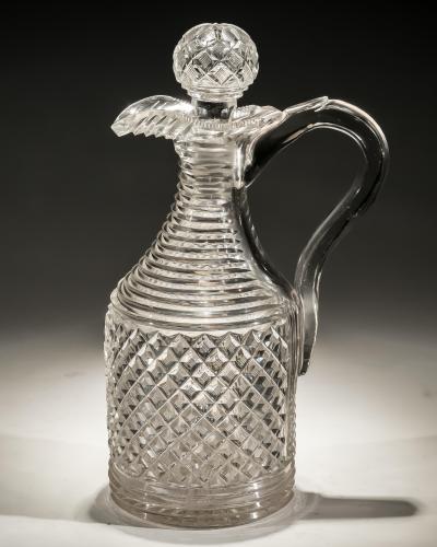 A STRAWBERRY DIAMOND STEP CUT REGENCY CLARET JUG