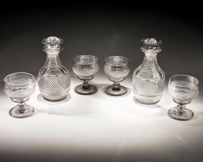 A SUITE OF IRISH REGENCY DECANTERS AND GOBLETS