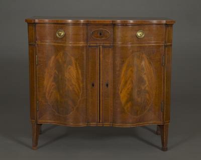 A SUPERB QUALITY FIDDLEBACK AND FLAME MAHOGANY TWO DOOR COMMODE