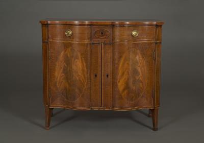 A SUPERB QUALITY FIDDLEBACK AND FLAME MAHOGANY TWO DOOR COMMODE