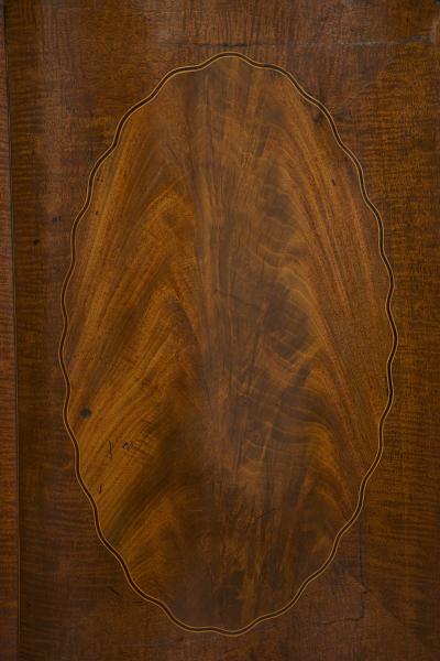 A SUPERB QUALITY FIDDLEBACK AND FLAME MAHOGANY TWO DOOR COMMODE