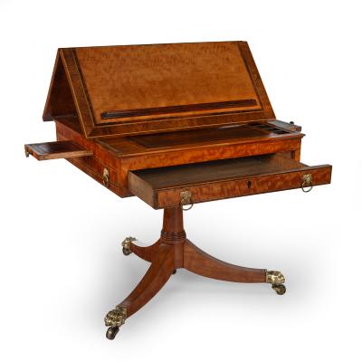 A Satinwood Reading and Writing Table with Campaign Features Possibly Irish
