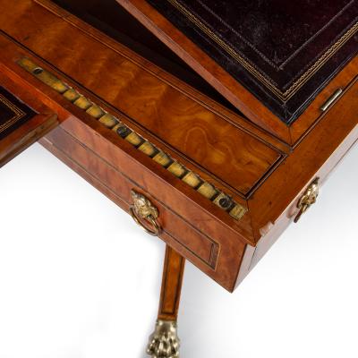 A Satinwood Reading and Writing Table with Campaign Features Possibly Irish