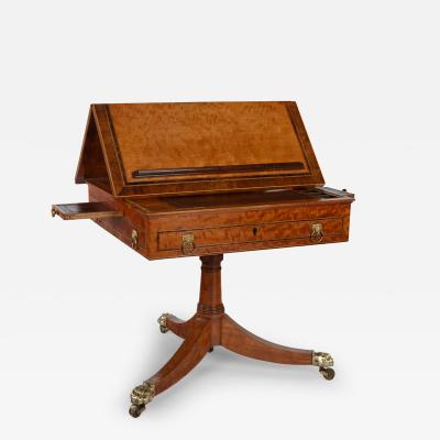 A Satinwood Reading and Writing Table with Campaign Features Possibly Irish