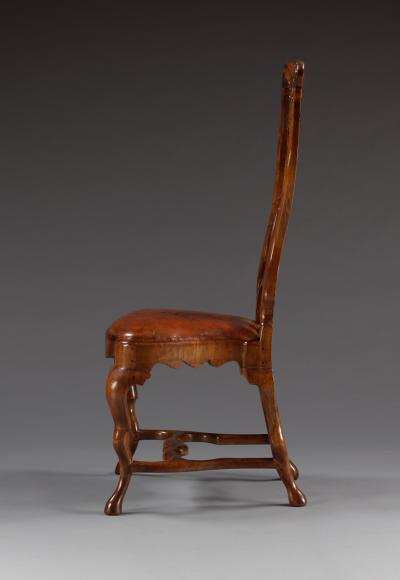 A Set Of Twelve Carved Walnut Dining Chairs Of Unusual Undulating Form