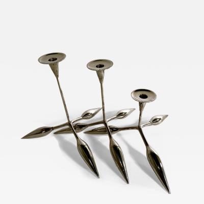 A Set of 3 Italian Modern Chrome Candle Sticks