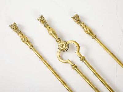 A Set of Brass Leopard Head Andirons