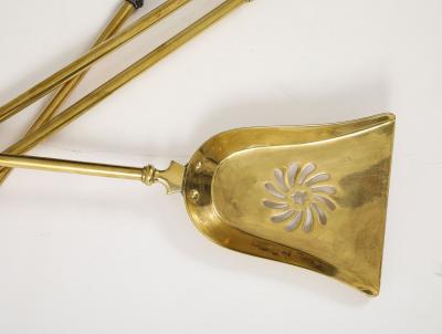 A Set of Brass Leopard Head Andirons