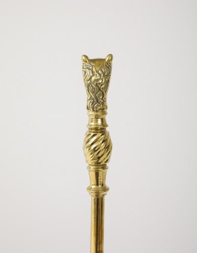 A Set of Brass Leopard Head Andirons