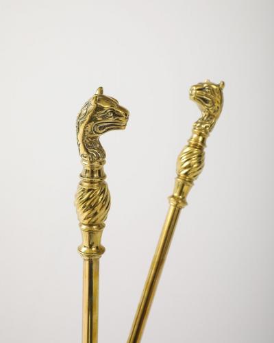 A Set of Brass Leopard Head Andirons