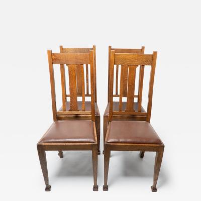 A Set of Four Arts Crafts Oak Dining Chairs with Comfortable Shaped Backs