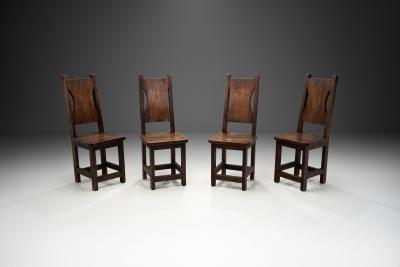A Set of Four Stained Beech Modernist Dining Chairs France 1950s