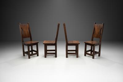 A Set of Four Stained Beech Modernist Dining Chairs France 1950s