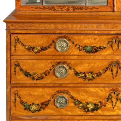 A Sheraton period West Indian satinwood secretaire bookcase