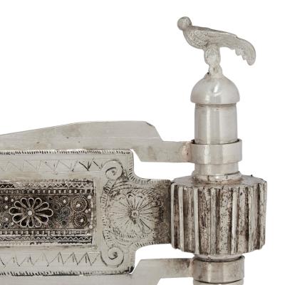 A Silver and Silver Filigree Purim Rattle with Bird Finial