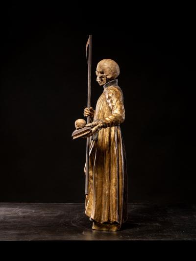 A South German polychromed and gilt wood figure of a Monastic Poor Soul 