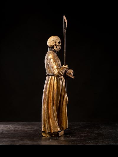 A South German polychromed and gilt wood figure of a Monastic Poor Soul 
