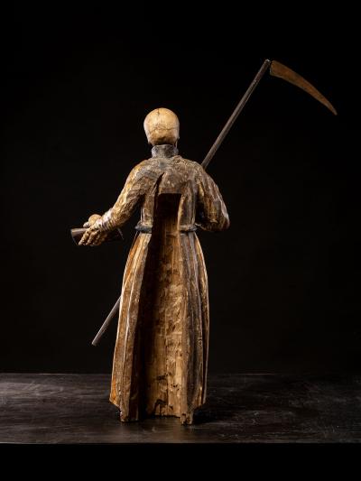 A South German polychromed and gilt wood figure of a Monastic Poor Soul 