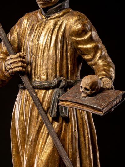 A South German polychromed and gilt wood figure of a Monastic Poor Soul 
