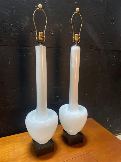 A Statuesque pair of Cased Glass Murano table lamps on Black Walnut bases