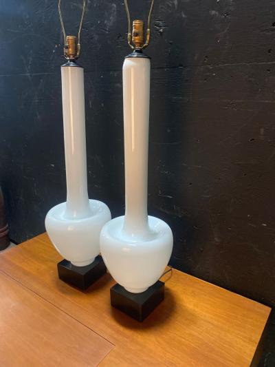 A Statuesque pair of Cased Glass Murano table lamps on Black Walnut bases