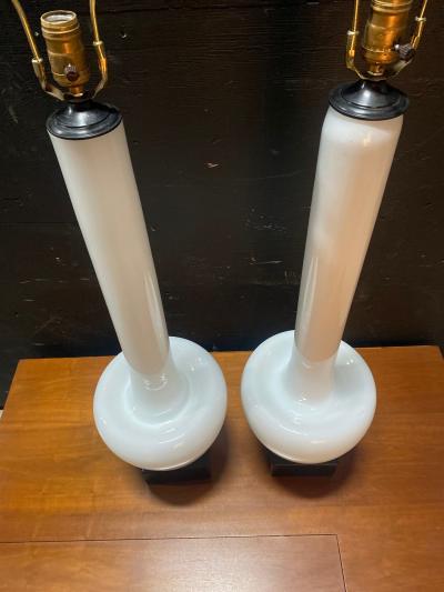 A Statuesque pair of Cased Glass Murano table lamps on Black Walnut bases