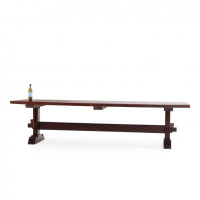 A Substantial Brazilian Trestle Table C 1920 made from a dense wood 