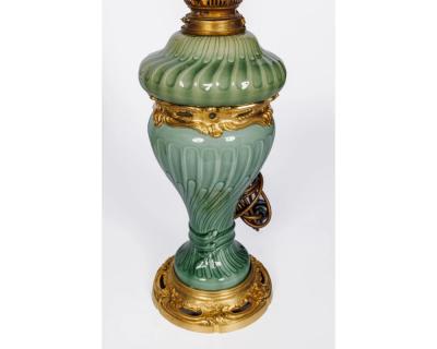 A Suite of Four Theodore Deck Ormolu Mounted Celadon Green Porcelain Lamps