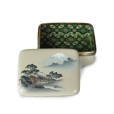 A Taisho period cloisonn box and cover with a watermill and Mount Fuji