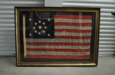 A Thirteen star American flag Circa 1896 1926 in the medallion configuration