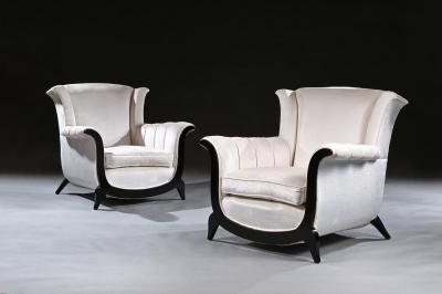 A UNUSUAL PAIR OF FRENCH ART DECO EBONISED ARMCHAIRS IN A CRUSHED VELVET