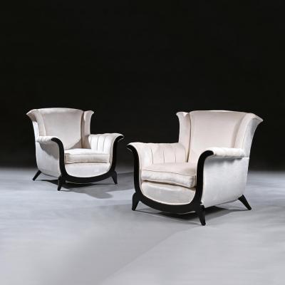 A UNUSUAL PAIR OF FRENCH ART DECO EBONISED ARMCHAIRS IN A CRUSHED VELVET