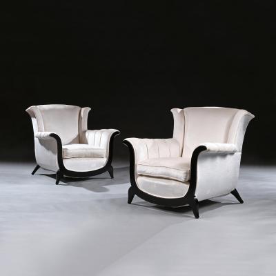 A UNUSUAL PAIR OF FRENCH ART DECO EBONISED ARMCHAIRS IN A CRUSHED VELVET