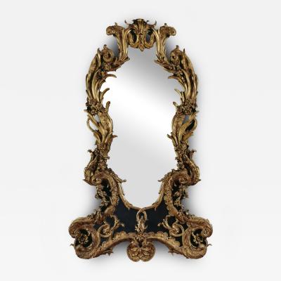 A VERY FINE AND UNUSAL GILTWOOD MIRROR