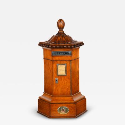 A Victorian English oak 6 sided Country house letter box