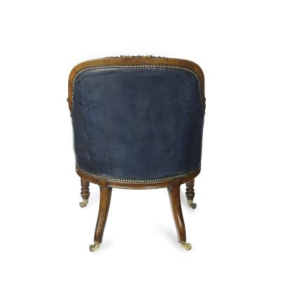 A Victorian blue leather oak library chair