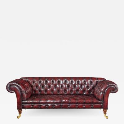 A Victorian deep buttoned Chesterfield settee