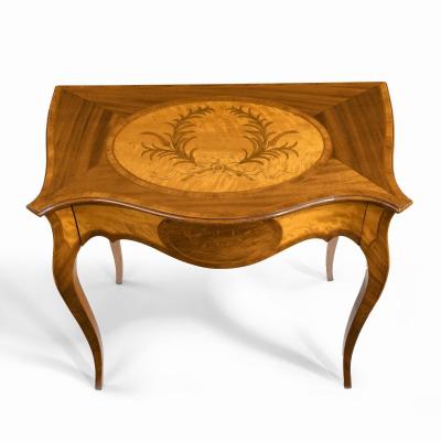 A Victorian inlaid satinwood and kingwood table in the style of Hepplewhite