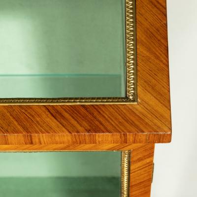A Victorian kingwood display cabinet in French taste