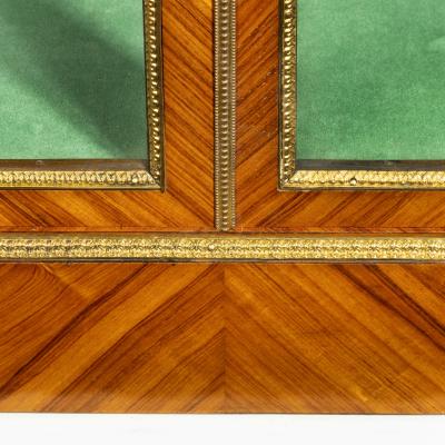 A Victorian kingwood display cabinet in French taste