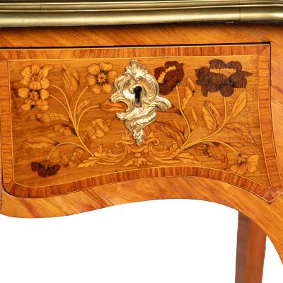 A Victorian kingwood marquetry writing table in the French taste