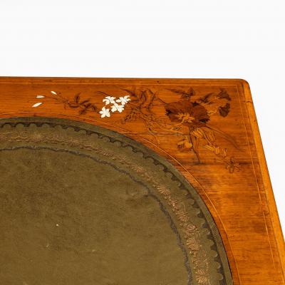 A Victorian walnut marquetry writing table attributed to Edward Holmes Baldock