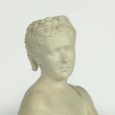 A Victorian white painted terracotta bust of a young woman